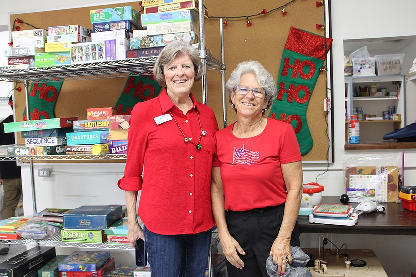 Karen Allen and Mary Searing from Stillpoint Mission help coordinate the toy distribution on Dec. 6.