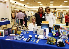 Susan Borden, Kelli Veit and Nancy Harris shared a bit about the goods and games available at Temple Beth Israel's Hanukkah open house on Dec. 7.