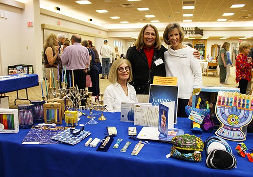 Susan Borden, Kelli Veit and Nancy Harris shared a bit about the goods and games available at Temple Beth Israel's Hanukkah open house on Dec. 7.
