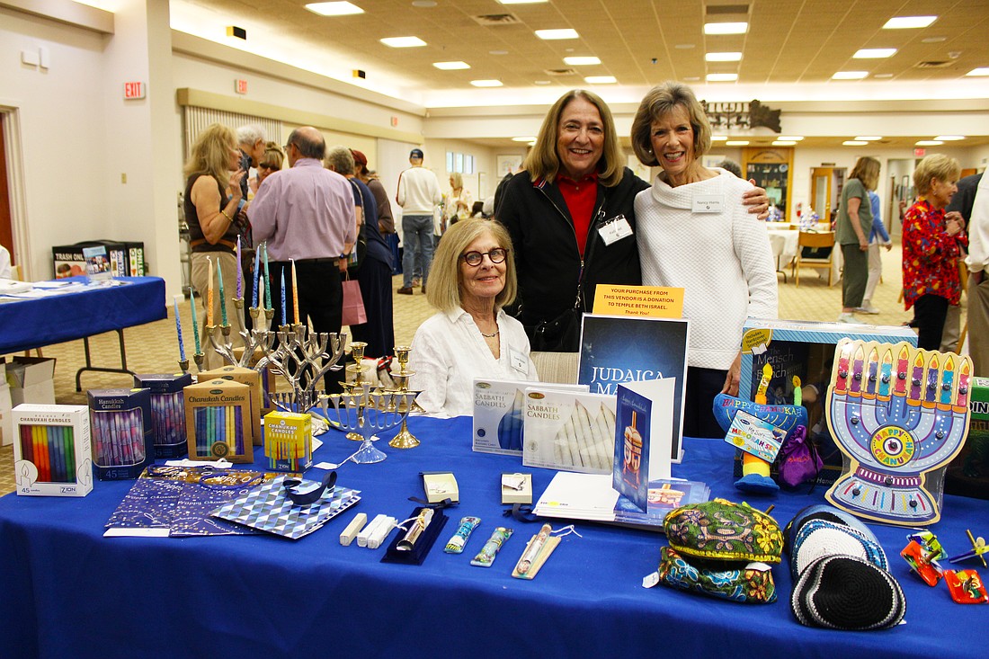 Susan Borden, Kelli Veit and Nancy Harris shared a bit about the goods and games available at Temple Beth Israel's Hanukkah open house on Dec. 7.
