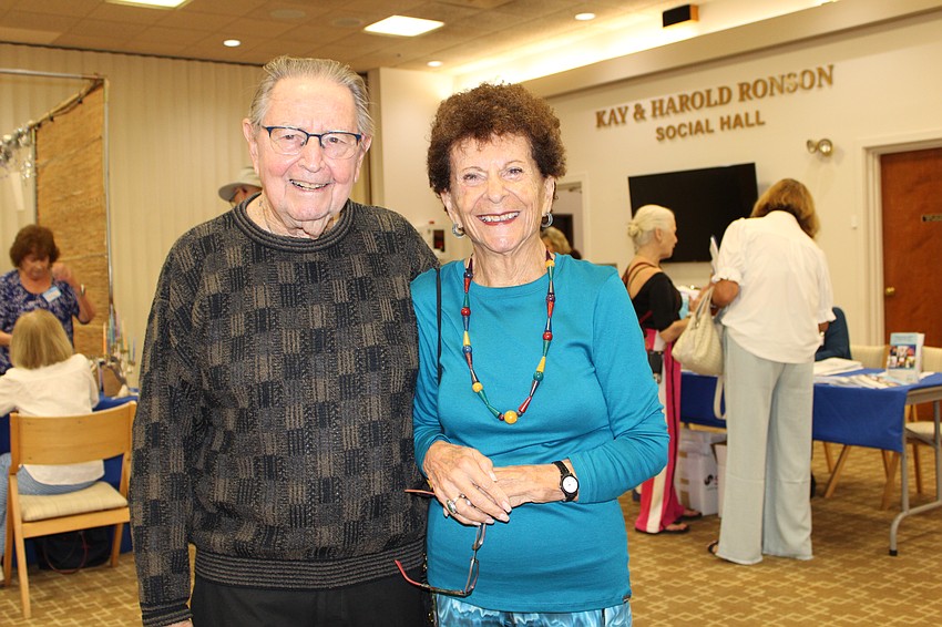 Rabbi Howard Simon and Barbara Pressman fully explored the Hanukkah open house at Temple Beth Israel last weekend.