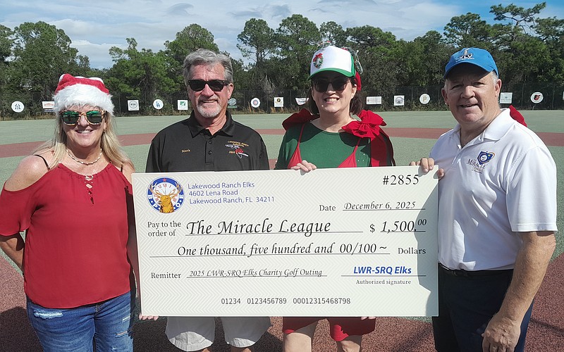 Miracle League Board President Robyn Graham, Elks Golf Tournament Director Mark Liddell, Elk Sarah Davis and Miracle League Executive Director Chris Cushman celebrate the Elks' $1,500 donation to the league.