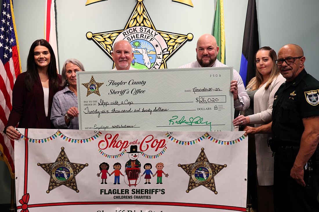 FCSO employees and community members have donate $40,000 to the 2025 Shop with a Cop. The above photos is a $26,000 check donated to the charity funding Shop with a Cop from FCSO employees. Courtesy photo