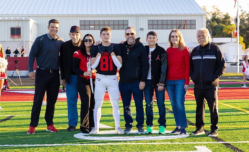 The extended Jordan Family gathers on the turf at Cardinal Mooney's Austin Smithers Stadium for senior night, held Oct. 31. From left: Coach Jared Clark, John Neidert, Julie Jordan, Mason Jordan, Mick Jordan, Dalton Jordan, Lindy Neidert and Richie Jordan. The extended Jordan Family gathers on the turf at Cardinal Mooney's Austin Smithers Stadium for senior night, held Oct. 31. From left: Coach Jared Clark, John Neidert, Julie Jordan, Mason Jordan, Mick Jordan, Dalton Jordan, Lindy Neidert and Richie Jordan.