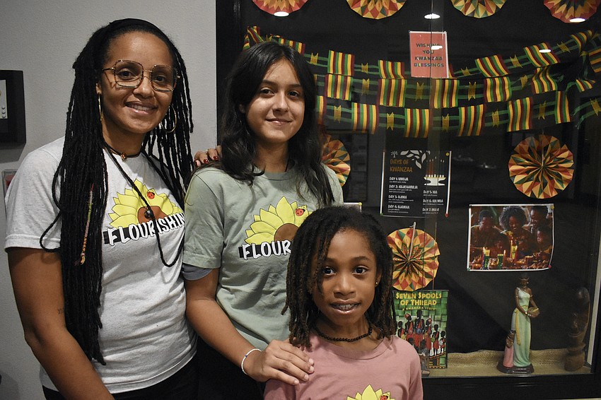 Margie Pierrelouis of Flourishing, an organization which offers middle and high school girls services that include academic support, leadership development and resources, brought along Aisy Diamond, 14, and Tegan Salem, 7, to participate in the event.