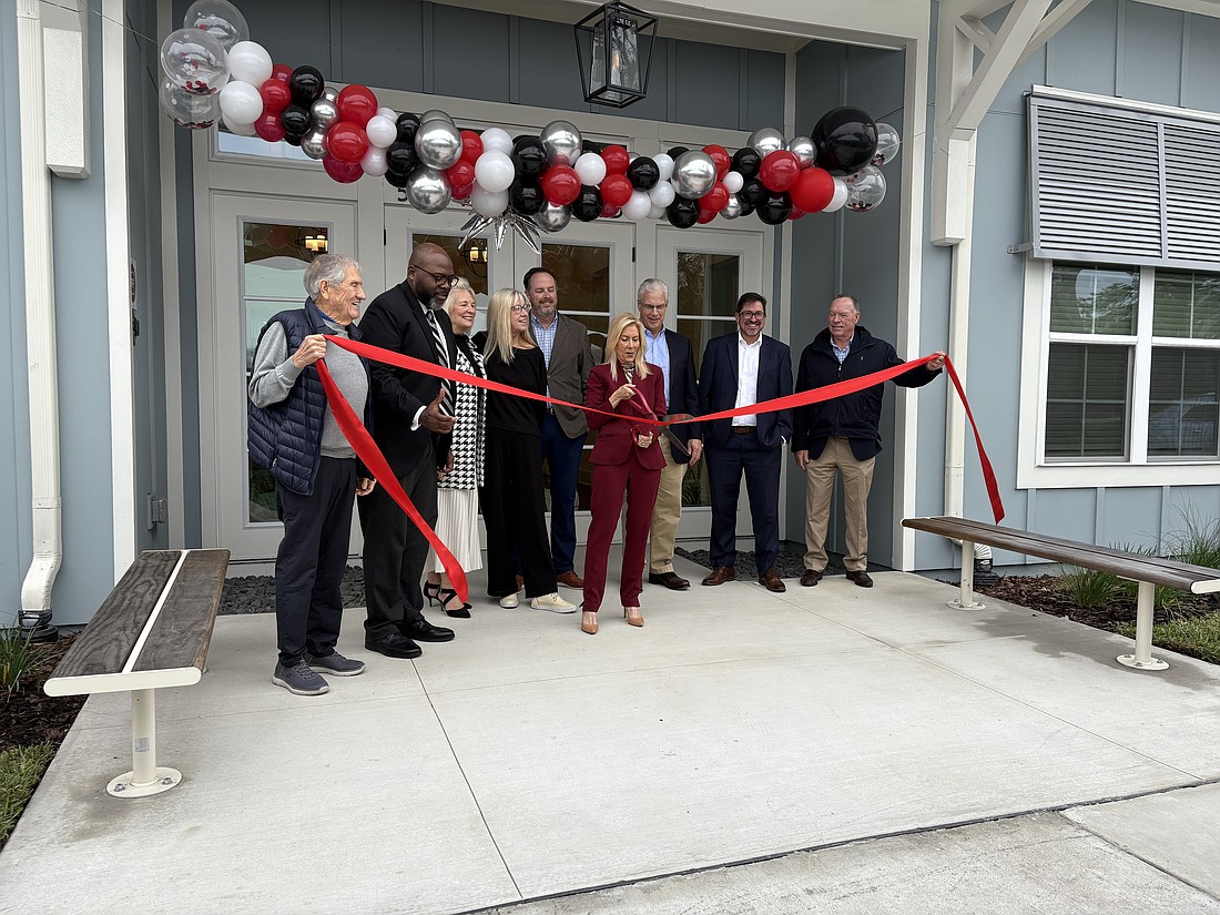 Mayor Donna Deegan cuts the ribbon during a Dec. 9 opening ceremony for the Village at Cedar Hills, an affordable housing community at 5051 Harlow Blvd. in West Jacksonville. Ability Housing, a Jacksonville-based nonprofit, developed the $30.7 million project.