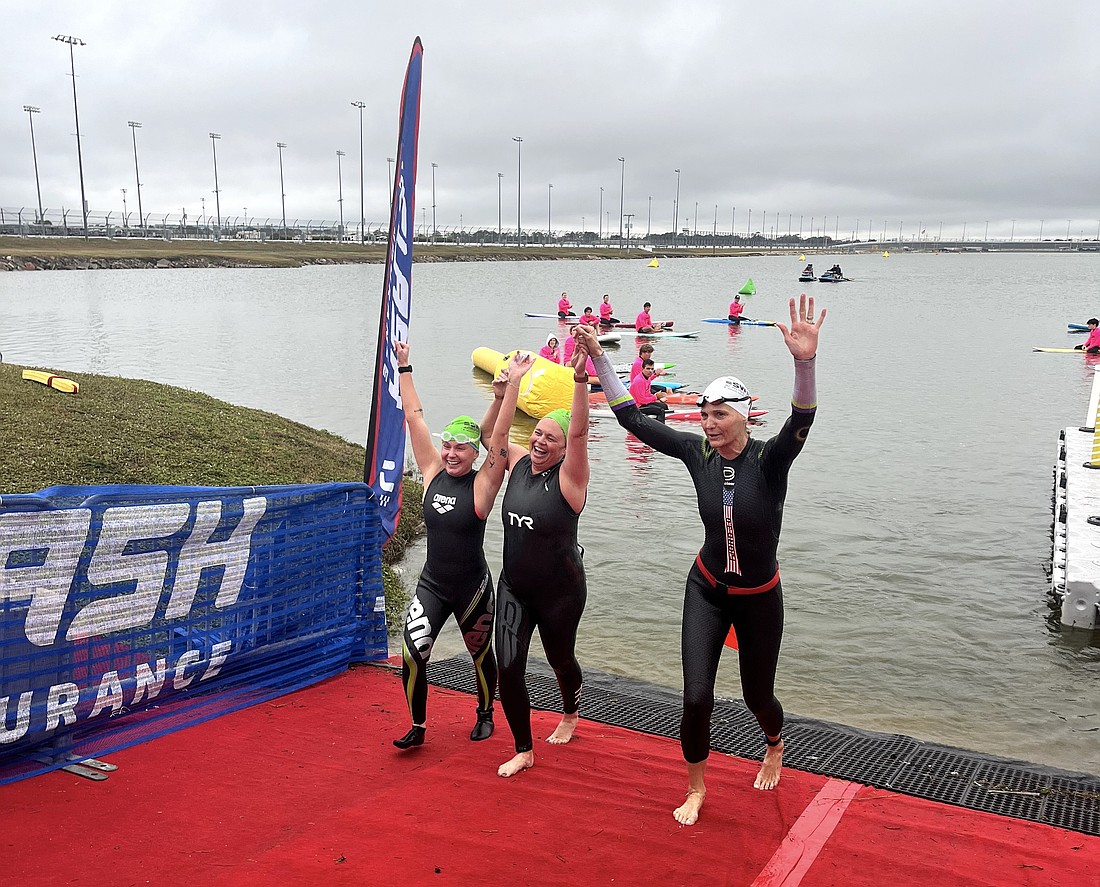 Swimmers complete their swim in Lake Lloyd at Daytona International Speedway on Dec. 7 in a Swim Across America event as part of a CLASH Endurance weekend. Courtesy photo