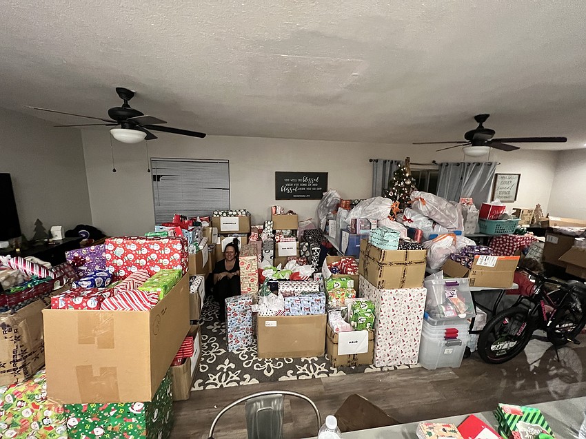Every year, A Heart to Give founder Terrie Scott's home is flooded with Christmas gifts to give thousands of children.