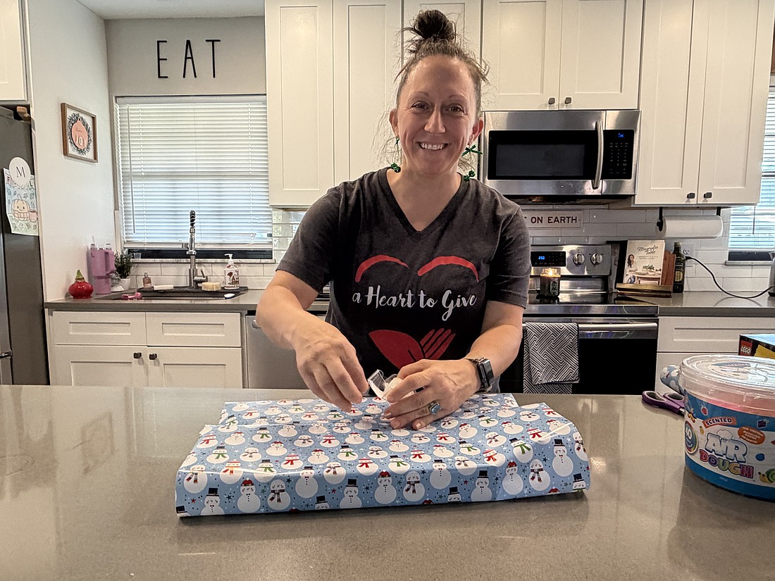 Terrie Scott spends every free moment she has during the holiday season wrapping gifts to give thousands of children through her nonprofit, A Heart to Give, which she runs out of her Ocoee home.