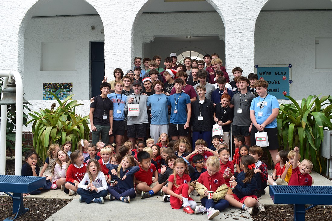 Riverview High baseball player-mentors pose for a photo on Dec. 9 with their kindergarten mentees at Southside Elementary School. Danielle Sobolewski, a kindergarten teacher at Southside, asked for some silly faces.