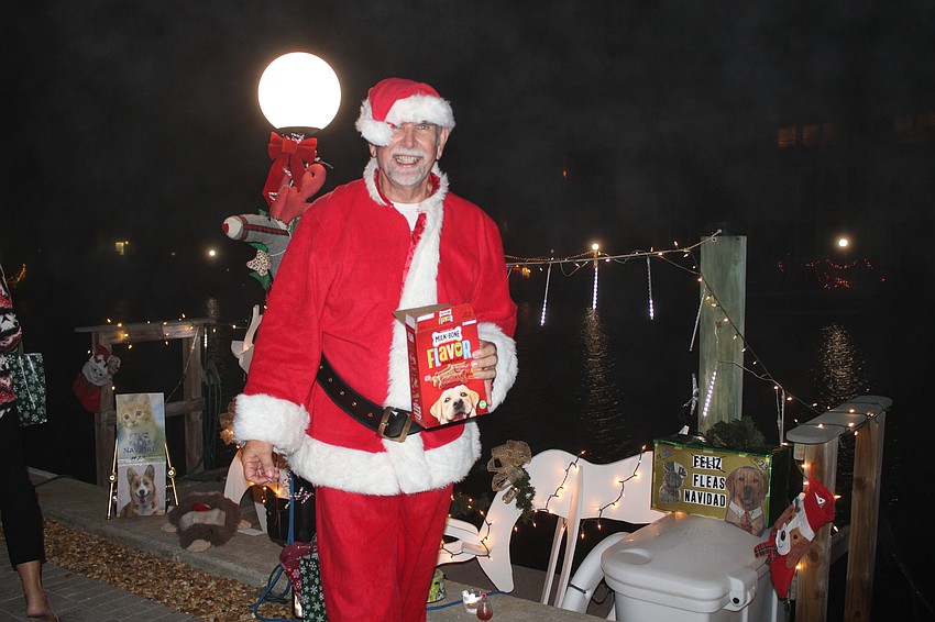 Jerry Herrick, dressed like Santa Claus, wishes everyone a 