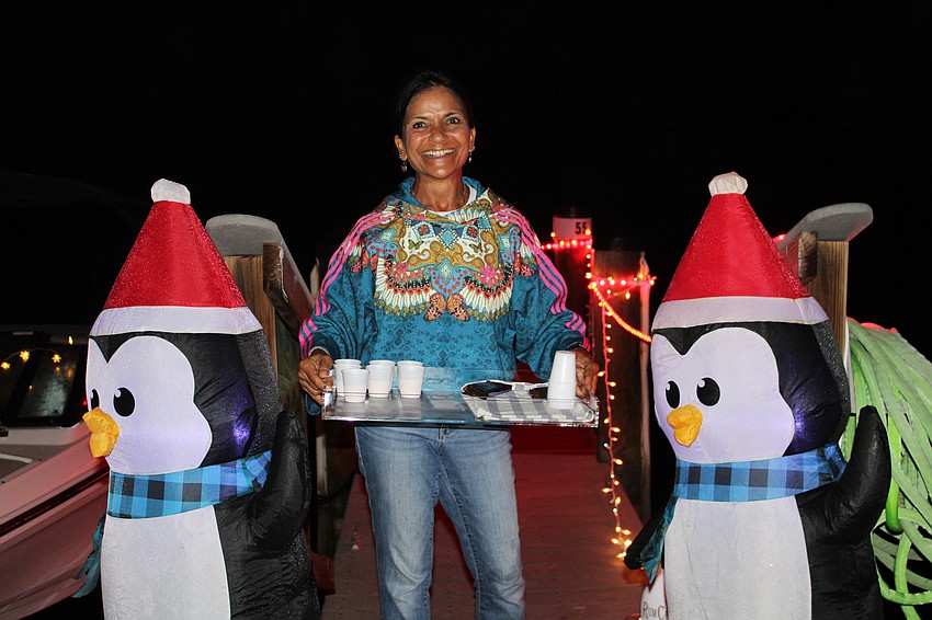 Kakali Banerjee offers chocolatey treats to participants at the Lighting of the Docks.