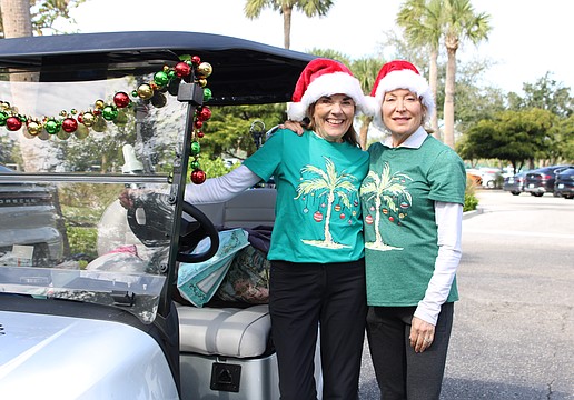 Beth Stewart and Christine Parseghian joined in the festive fun of the Frosty Frolic golf tournament on Dec. 9 at Harbourside Golf Course.