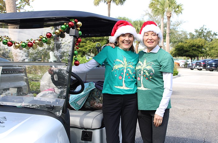 Beth Stewart and Christine Parseghian joined in the festive fun of the Frosty Frolic golf tournament on Dec. 9 at Harbourside Golf Course.