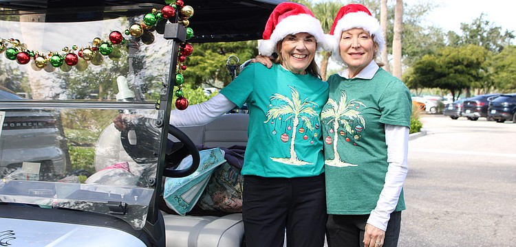 Beth Stewart and Christine Parseghian joined in the festive fun of the Frosty Frolic golf tournament on Dec. 9 at Harbourside Golf Course.