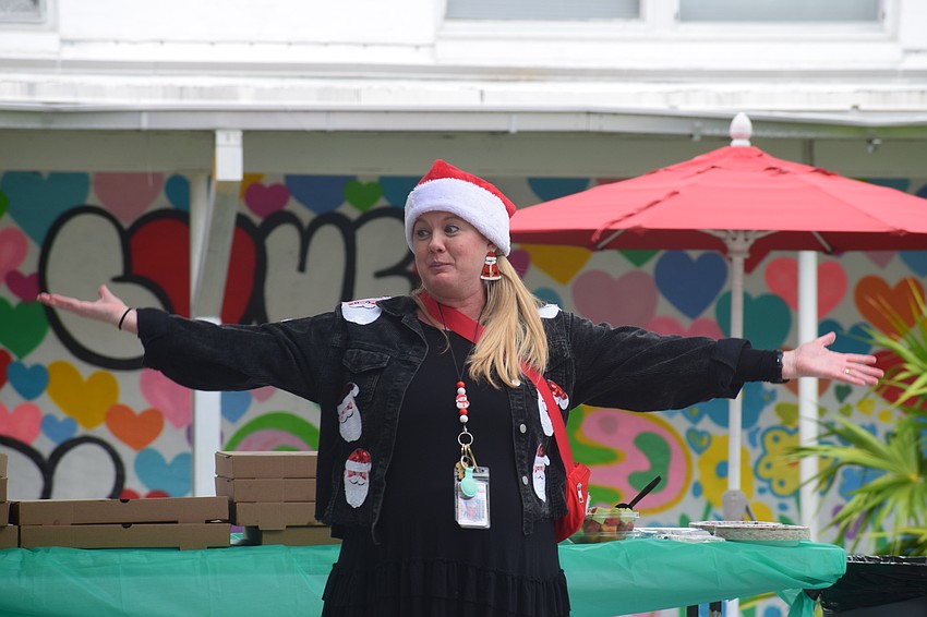 Danielle Sobolewski speaks to a packed courtyard at Southside Elementary School. She joined the program 11 years ago with Sarasota High, and in 2022, moved the partnership to Riverview High.