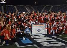 Cardinal Mooney football gathers at midfield and poses for a photo. The Cougars scored on every single one of their drives in the FHSAA Class 2A state championship, piling up 52 points against the Bulldogs.