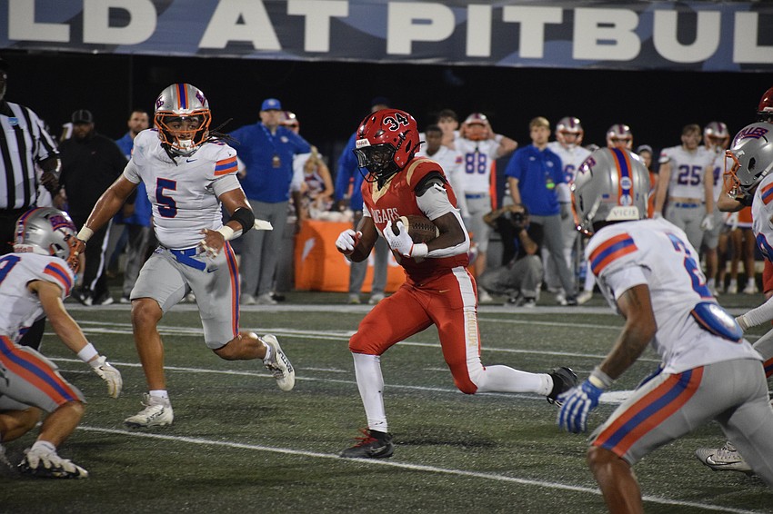 Connail Jackson hits a pocket of space during the FHSAA Class 2A state championship. The running back thrashed the Bulldogs' defense with four touchdowns to finish his junior season with 39 in all.