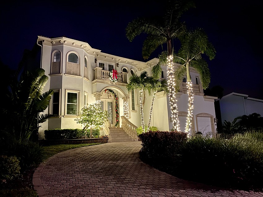 572 Halyard Lane brings a stately twinkle to the neighborhood with its holiday lights.