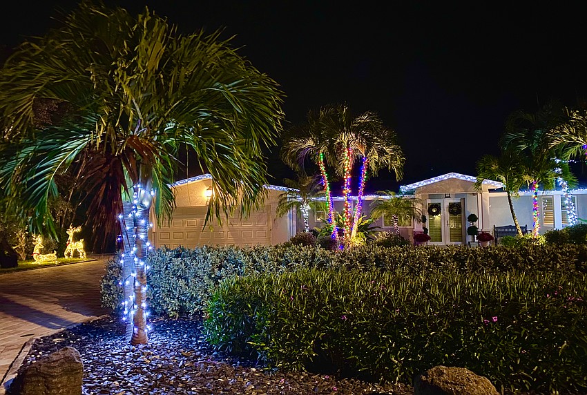 604 Buttonwood Drive joins in the holiday fun with a colorful light display, complete with a pair of deer.