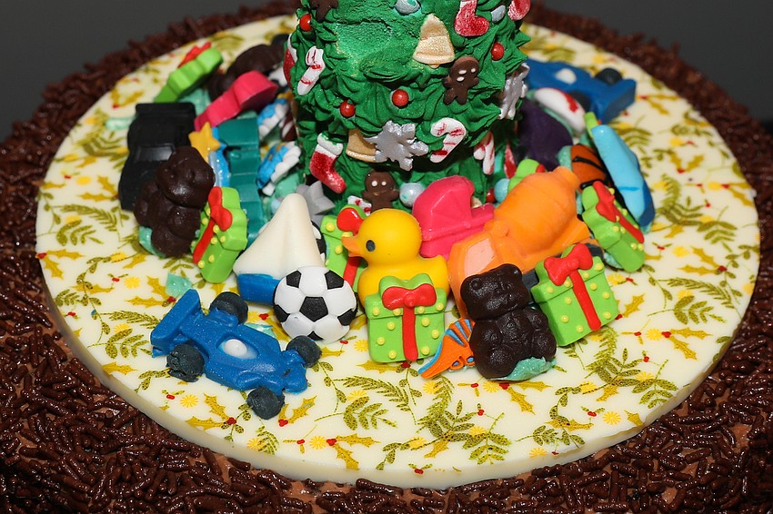 Michael's On East designed and donated this holiday cake to raise money for SPARCC.