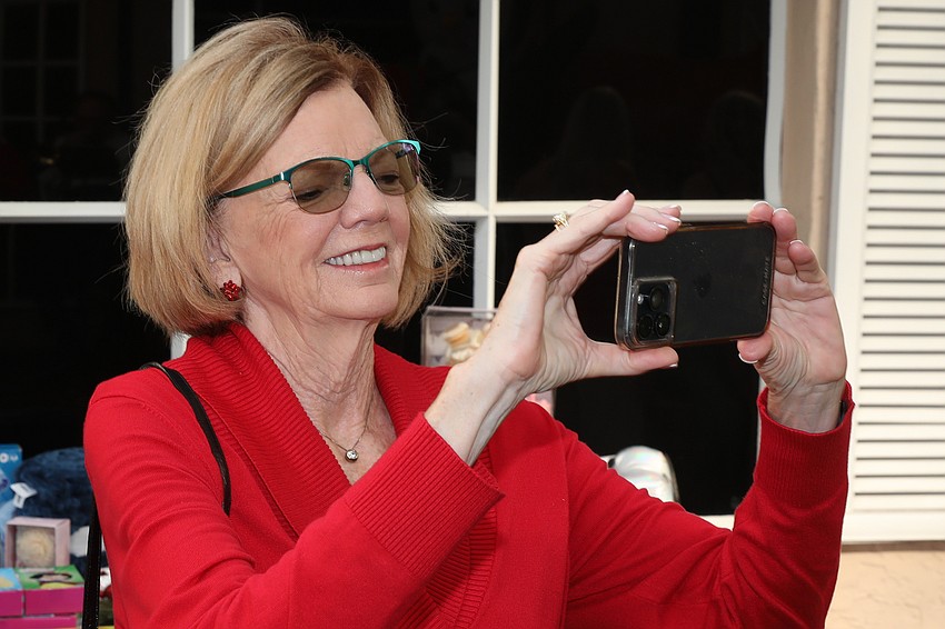 Sherry Kenny snaps a shot of the brass quintet.