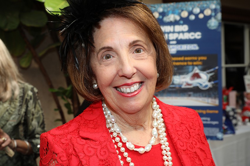 Patricia Rinehart rocks her holiday red.