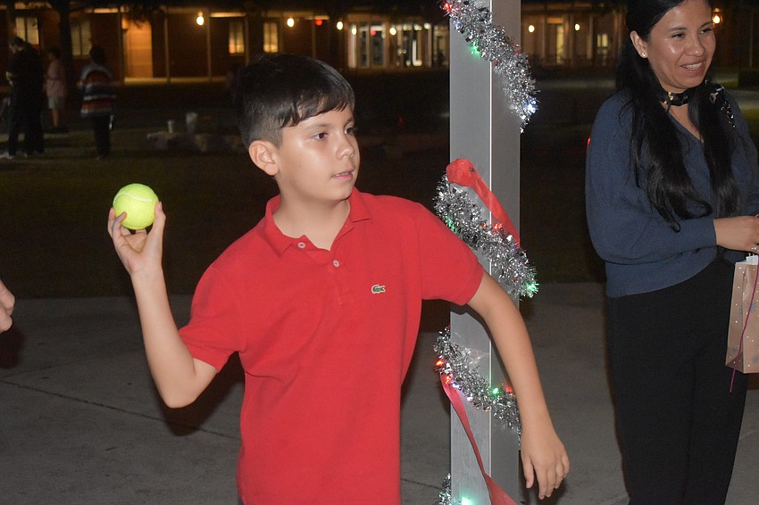 Sarasota's William Kirby-Maye, 10, plays the Tower Down game created by the Red Cross Club at Braden River High School.