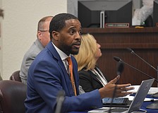 Jamara Clark, director of student enrollment for the School District of Manatee County, presents information on school choice to members of the school board on Dec. 9.