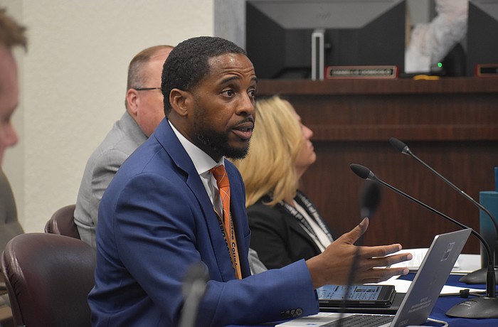 Jamara Clark, director of student enrollment for the School District of Manatee County, presents information on school choice to members of the school board on Dec. 9.
