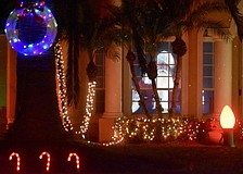 Santa greets visitors from the window of 9605 Governor's Club Place in The River Club.