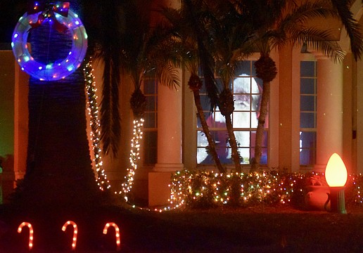 Santa greets visitors from the window of 9605 Governor's Club Place in The River Club.