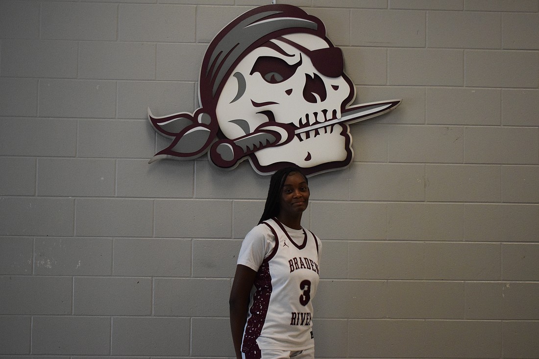 Kelis McGrady poses for a photo on Dec. 11 before Braden River girls basketball's home game against Manatee. The forward/guard has been the engine behind the Pirates' early-season success.