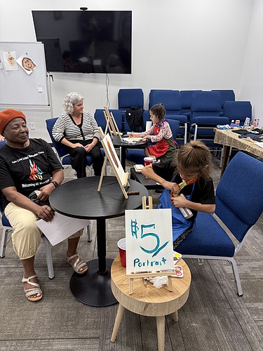 Kindergarteners operate the portrait booth at United Methodist Christian School's Little Picasso Art Show. Courtesy photo