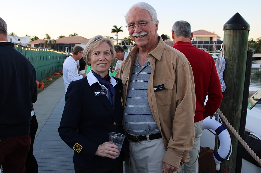 Bird Key Yacht Club Rear Commodore Lynne Pettigrew and Brian Moore make their way around the docks at the Dec. 11 Blessing and Lighting of the Fleet.