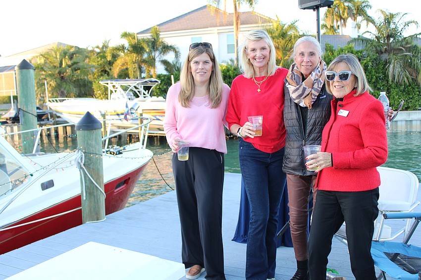 Buffy Perkins, Laura Travis, Becky Keagy and Sharon Kenworthy admire the sunset over the Sarasota skyline at the Blessing and Lighting of the Fleet.