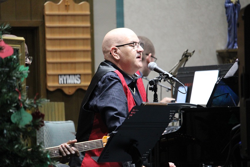 Pianist Greg Murray leads members of The Venice Symphony performing a Christmas concert at St. Mary, Star of the Sea, Catholic Church.