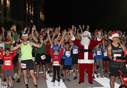 Santa (Steven Trudell of St. Petersburg) gets the runners fired up just before the start of the 2025 Jingle 5K Dec. 12 in Lakewood Ranch.