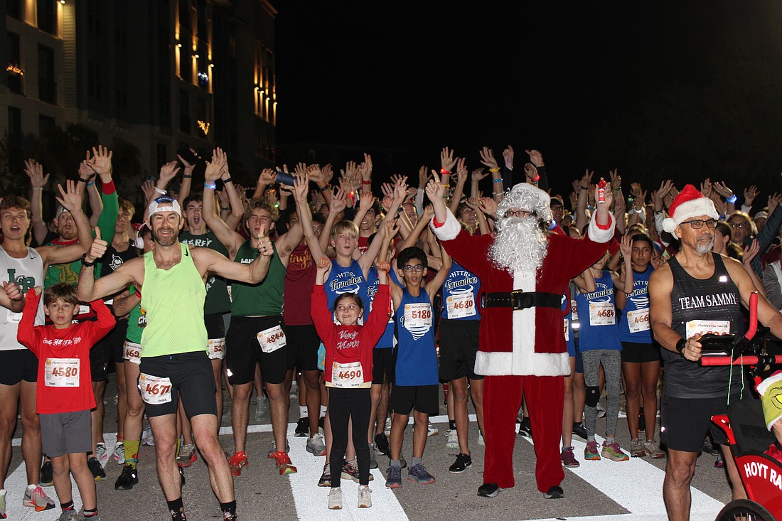 Santa (Steven Trudell of St. Petersburg) gets the runners fired up just before the start of the 2025 Jingle 5K Dec. 12 in Lakewood Ranch.