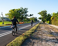 Cyclists utilize the bike lanes on Gulf of Mexico Drive along the newly completed Country Club Shores turn lane project portion of the street. The 0.84-mile segment marks the first example of the town’s Complete Streets vision.