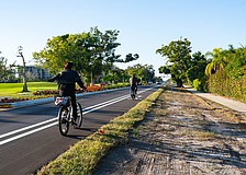 Cyclists utilize the bike lanes on Gulf of Mexico Drive along the newly completed Country Club Shores turn lane project portion of the street. The 0.84-mile segment marks the first example of the town’s Complete Streets vision.