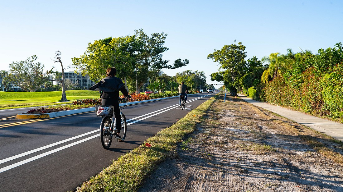 Cyclists utilize the bike lanes on Gulf of Mexico Drive along the newly completed Country Club Shores turn lane project portion of the street. The 0.84-mile segment marks the first example of the town’s Complete Streets vision.