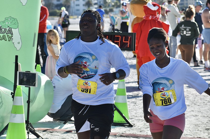 Jahbez Benga and Martha Benga complete the race.