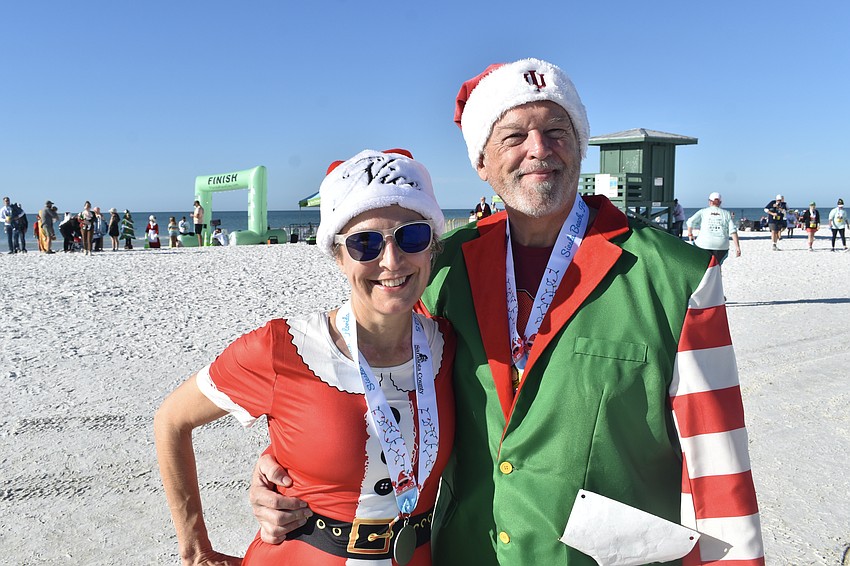 Heidi Anderson and Roy Sprinkle were among the many runners dressed in festive attire.