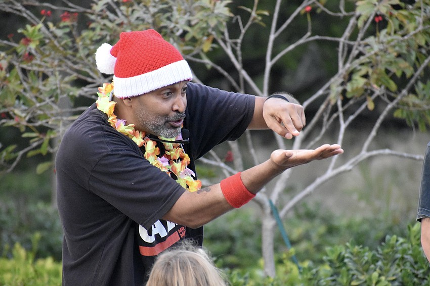 Mindfulness educator Stevey Jones (Mr. Stevey) leads kids in Mr. Stevey  Storytime, encouraging them to imagine falling snowflakes.