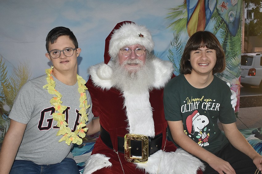 Krasi Atanasov and Jon Selcuk enjoy a visit with Santa Claus.