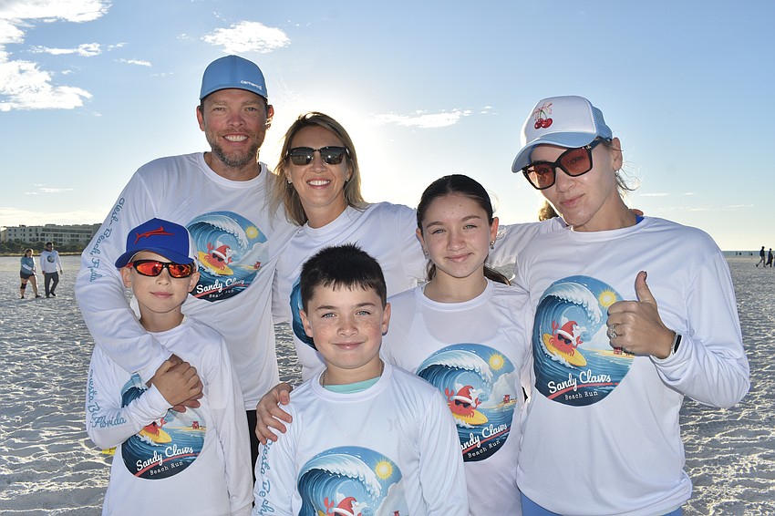 Luka Tikuisis, 7, Dave Tikuisis, Tatyana Tikuisis, Ari Presman, 8, Mia Presman, 10, and Inessa Pressman get ready to race.