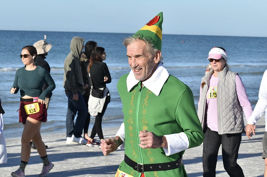 Scott James dressed up like Buddy the Elf for the run.
