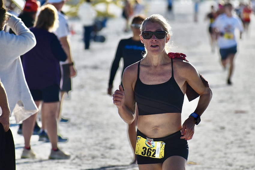 First overall female Vicky Romocki makes her way towards the finish line.