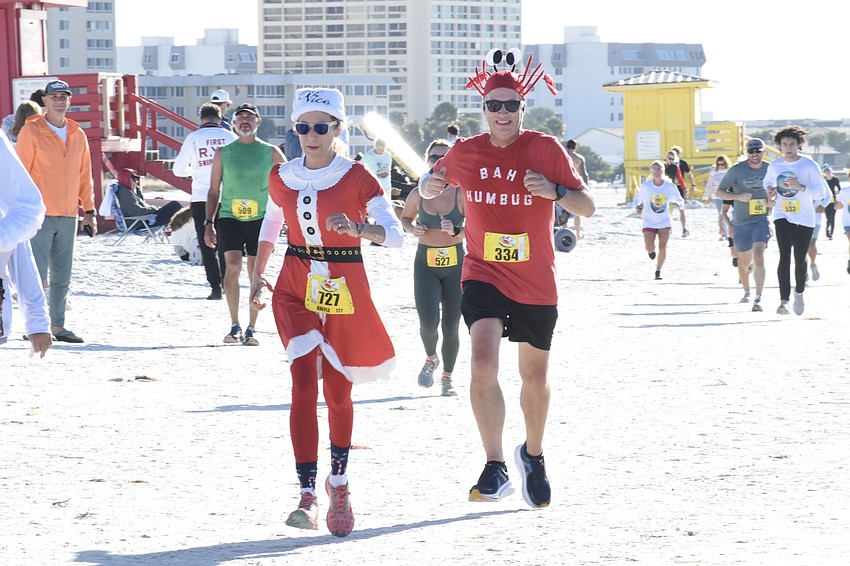Heidi Anderson and Aaron Gordon approach the finish line.